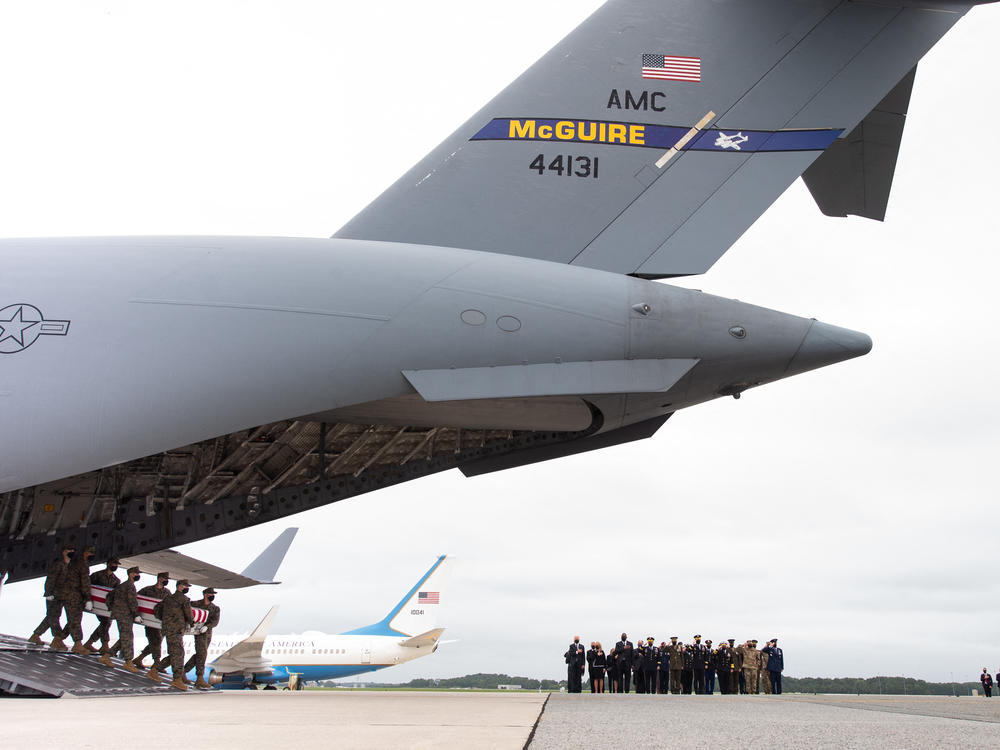 President Biden and his aides traveled to Dover, Del., to pay their respects and comfort the families of the 13 U.S. service members killed in Afghanistan last week.