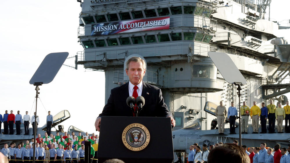 In this May 1, 2003 file photo, President George W. Bush speaks aboard the aircraft carrier USS Abraham Lincoln off the California coast.