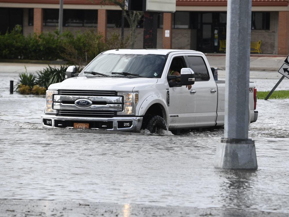 A truck in high water from Hurricane Ida near Highway 61 in Destrehan, Louisiana, on August 30, 2021.