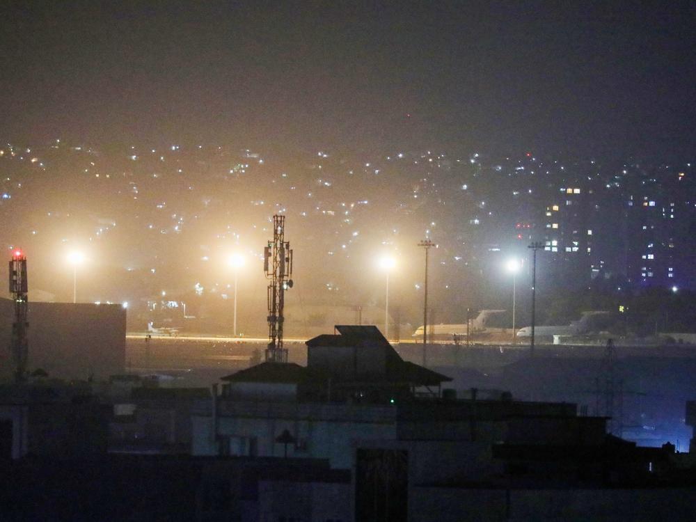 Planes are seen on the tarmac at the airport in Kabul late on August 30, 2021, hours ahead of the U.S. deadline to complete its frenzied withdrawal from Afghanistan.