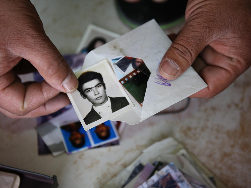 Uncollected or duplicate photographs found in boxes and drawers in backrooms of Kabul's photo studios.