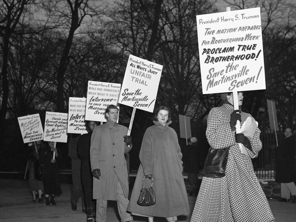 As temperatures drop below freezing, demonstrators march in front of the White House in Washington in 1951, in an effort to persuade President Harry Truman to halt execution of seven Black men sentenced to death in Virginia on charges of raping a white woman.