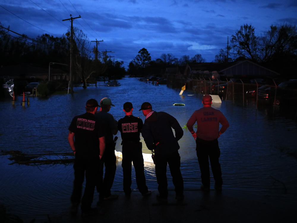 First responders prepare to launch rescue boats to transport residents out of flooded areas of LaPlace, La., on Monday.