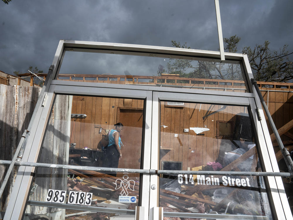 Marquita Jenkins stands in the ruins of her mother's Be Love hair salon, which was destroyed by Hurricane Ida whose eastern wall went right over LaPlace.