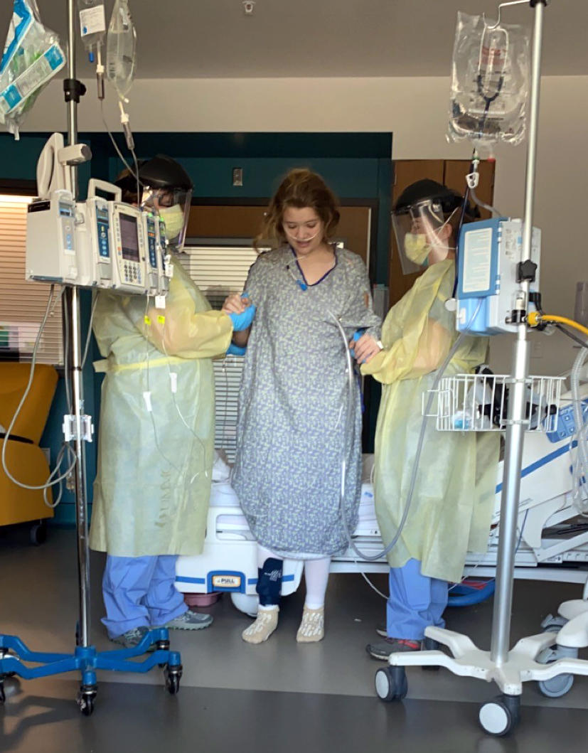 Aides help Allie walk during her hospitalization in January. Even after she was able to return to school, recovery was slow. She was overcome by seizures sometimes and passed out at least twice. One night, Allie awoke and couldn't feel her legs.