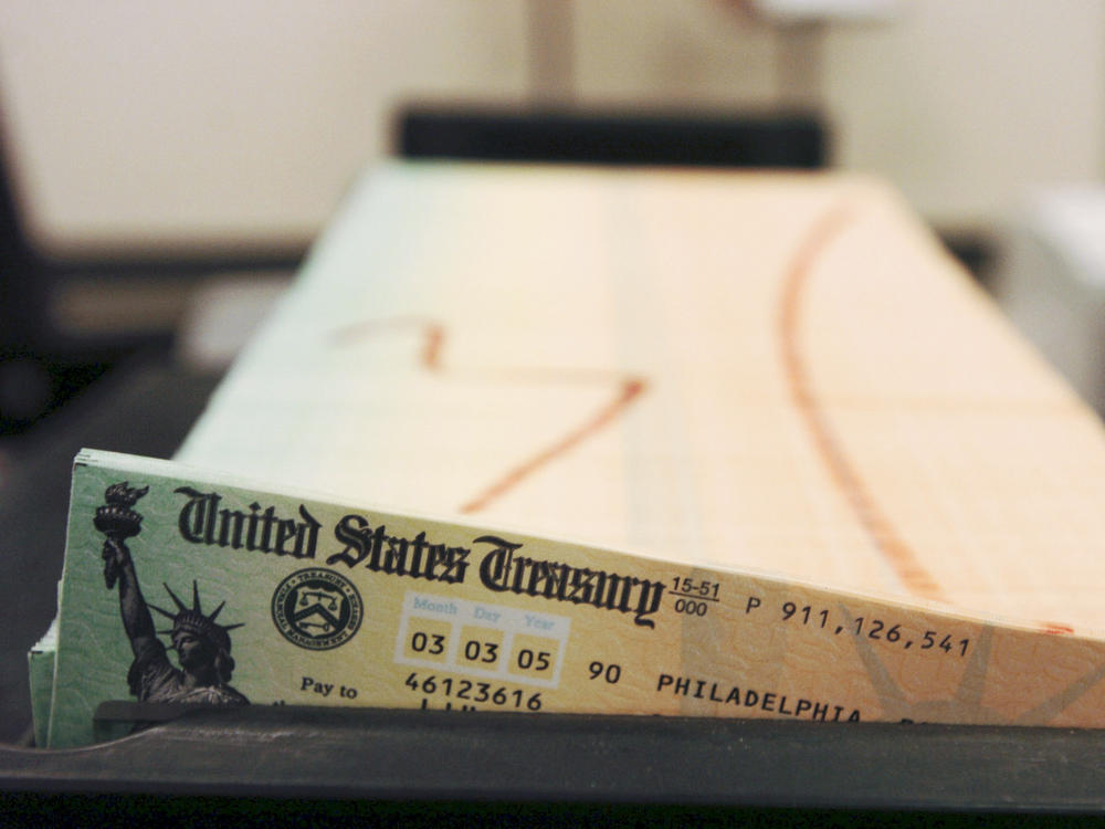In this Feb. 11, 2005 file photo, trays of printed social security checks wait to be mailed from the U.S. Treasury's Financial Management services facility in Philadelphia. The financial impact of the coronavirus pandemic on Social Security and Medicare is front and center as the government releases its annual report on the state of the bedrock retirement programs on Tuesday, Aug. 31, 2021.