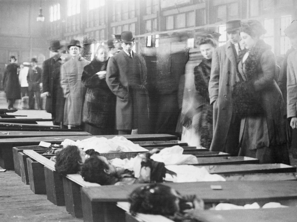 Family members arrive at the New York City morgue to identify the bodies of victims of the Triangle Shirtwaist Company Fire that killed 146 factory workers, mainly young immigrant women.