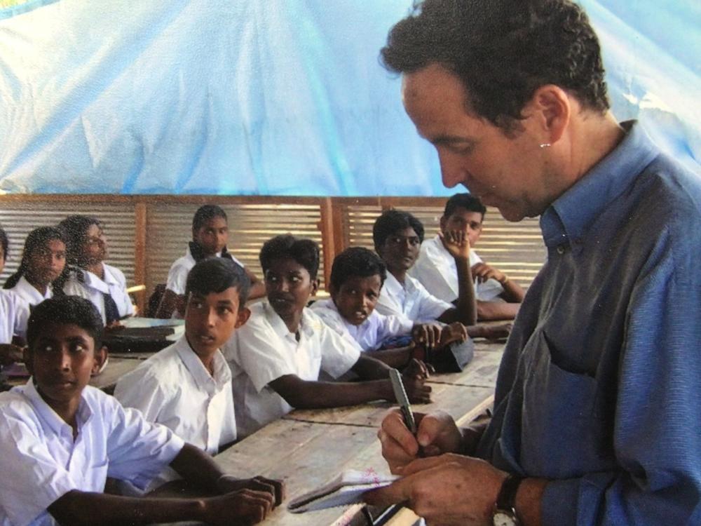 Joel Charny, who's been a humanitarian aid worker for 40 years, talks to students at a camp for internally displaced people in northern Sri Lanka in 2005. It's one of his favorite photos, he says, 