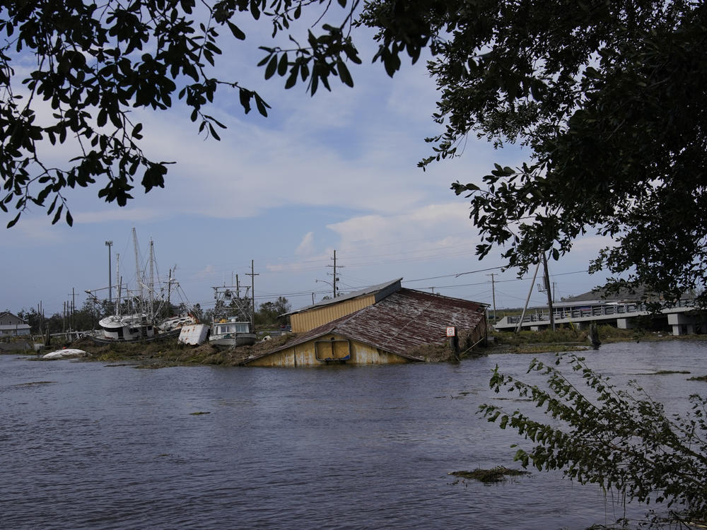 Flood damaged buildings and boats in the aftermath of Hurricane Ida, on Wednesday in Lafitte, La.