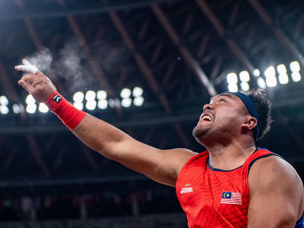 Malaysia's Muhammad Ziyad Zolkefli competes in the final of the men's shot put - F20 at the Tokyo 2020 Paralympic Games at the Olympic Stadium in Tokyo. He was later disqualified for being late to the event.