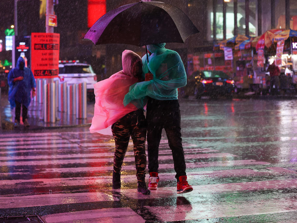 Heavy rainfall makes for a stormy Times Square outing Wednesday in New York City.