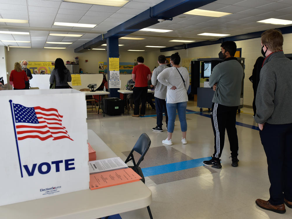 Georgia voters at an Atlanta polling place during the January runoff elections for two U.S. Senate seats. Election officials in the state say new laws and disinformation have made their jobs difficult.