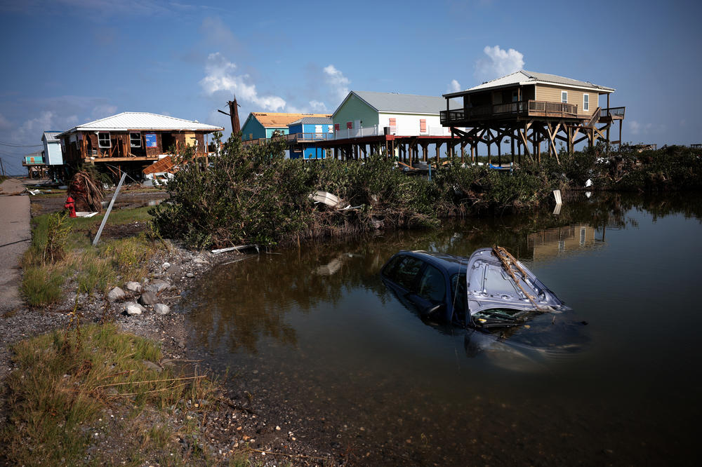 In Grand Isle, La., Ida, which struck as a hurricane over last weekend, destroyed homes and left an automobile submerged on Thursday.
