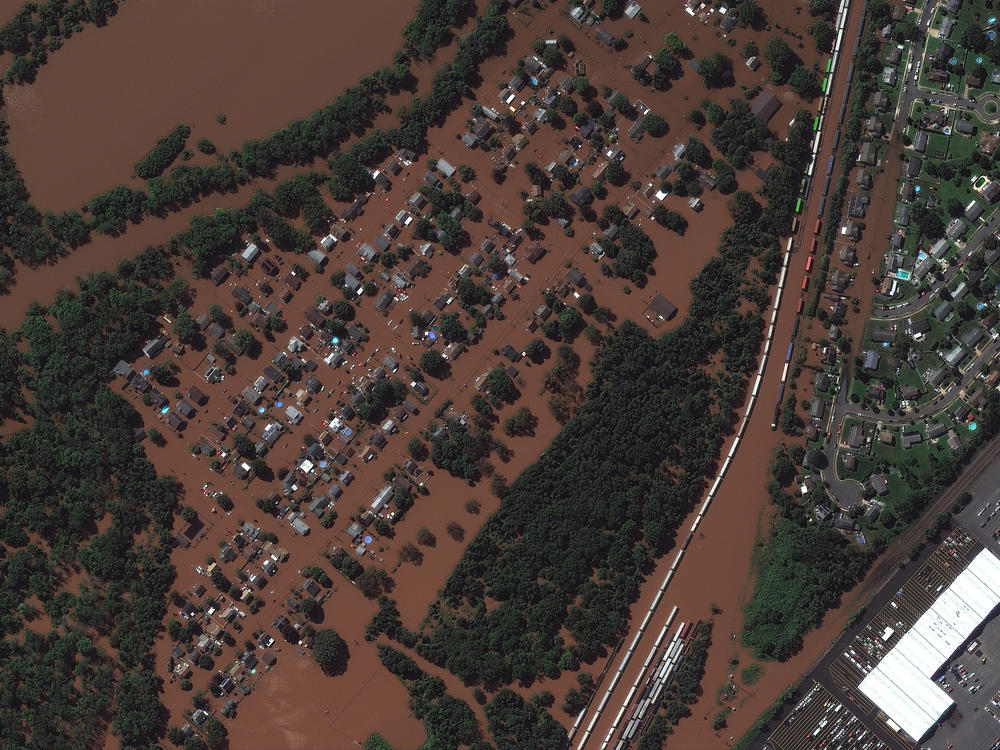<strong>DURING FLOOD - Sept. 2, 2021:</strong> Overview of flooded homes along Huff Avenue and Railyard in Manville, N.J.