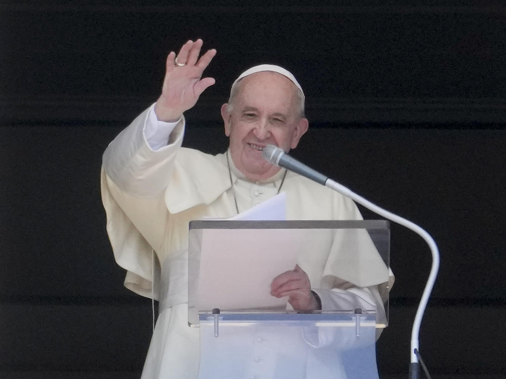 Pope Francis delivers his blessing as he recites the Angelus noon prayer from the window of his studio overlooking St.Peter's Square, at the Vatican, Sunday, Sept. 5, 2021.