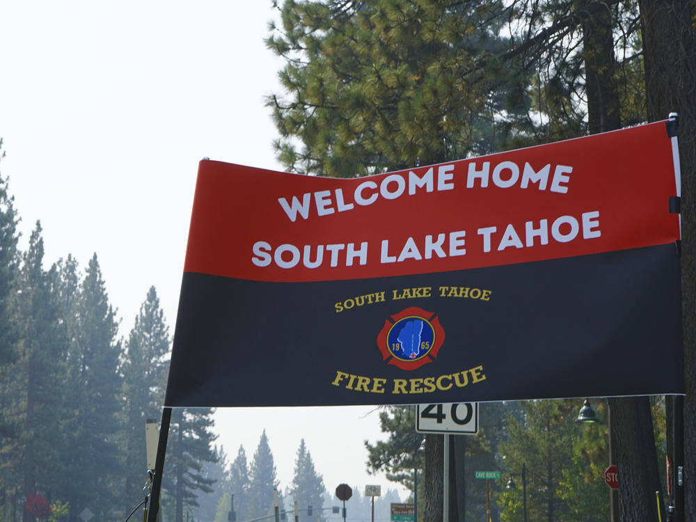 A sign outside a South Lake Tahoe fire station welcomes residents back after the lifting of evacuation orders Monday. The resort town was cleared last week due to the Caldor Fire.