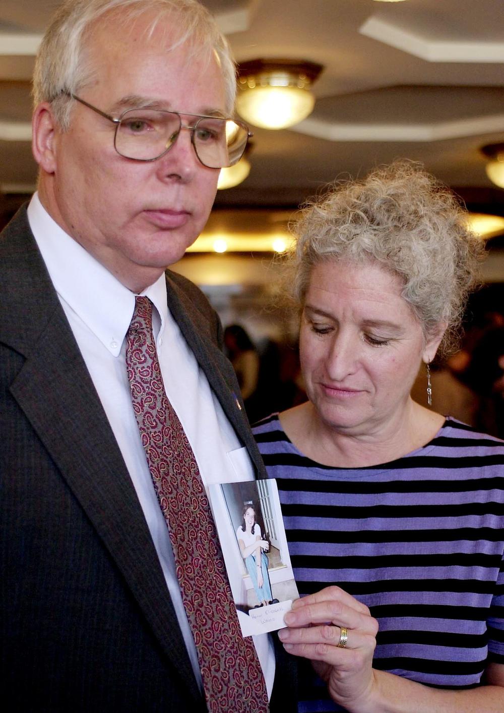Ben Wainio and his wife Esther Heymann show a photo of their daughter, Honor Elizabeth Wainio, who was killed on United Flight 93.