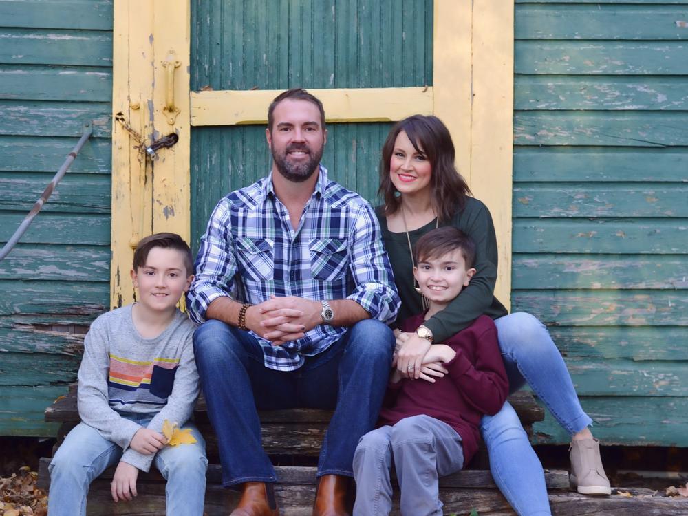 Brittany Schwaigert with her husband, Ryan, 13-year-old Greyson (far right) and 10-year-old Lachlan. Schwaigert is a lead plaintiff in a class action lawsuit challenging the Tennessee governor's opt-out policy on masks.