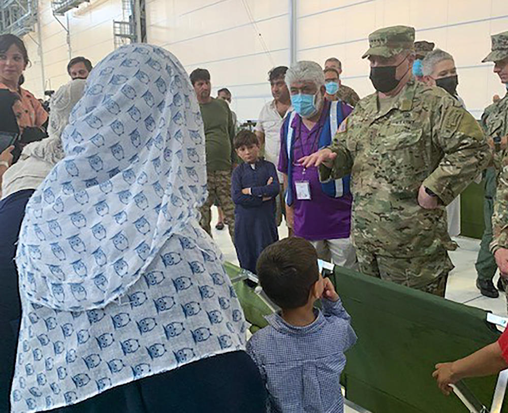 Gen. Mark Milley visited U.S. air bases in Germany, Italy and Spain over the weekend, where Afghans were screened before heading to the United States. Milley talked with refugees, asking about the food and medical services and their lives back in Afghanistan.