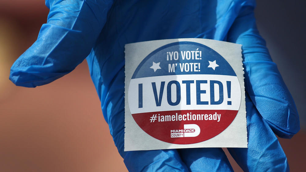 A voter holds an 