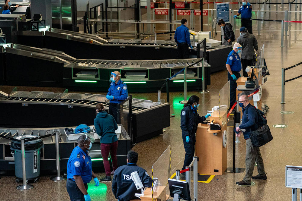 Travelers pass through security screening at Seattle-Tacoma International Airport on Nov. 29, 2020.