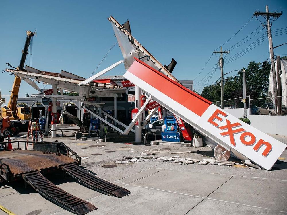 Workers clean a gas station damaged by the remnants of Hurricane Ida in New York City. Scientists warn that 60% of world oil reserves need to stay underground to avoid the worst impacts of climate change.