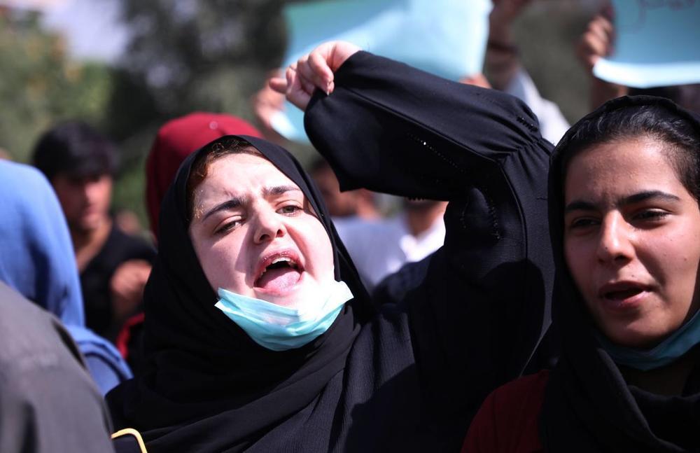 Afghans march toward the presidential building in Kabul in a protest against Pakistan on Tuesday.