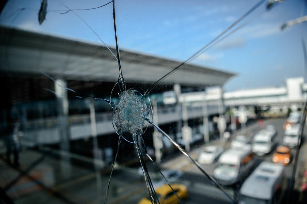 Bullet impacts mar a window at Ataturk Airport in Istanbul on June 29, 2016, the day after a suicide bombing and gun attack targeted the airport, killing 45 people.
