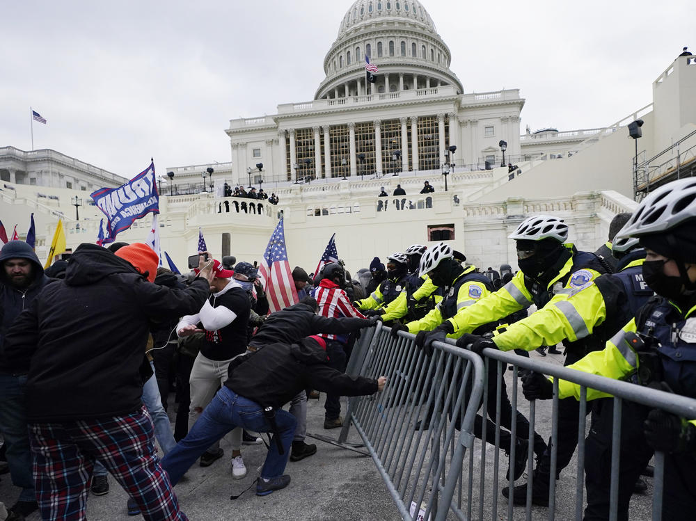 Trump supporters try to break through a police barrier Jan. 6 at the U.S. Capitol in Washington, D.C.