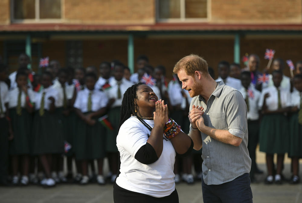 Prince Harry, right, speaks to Murimirwa during his visit to the Nalikule College of Education in Malawi in 2019. The Prince visited the school to learn how the group is supporting young women.