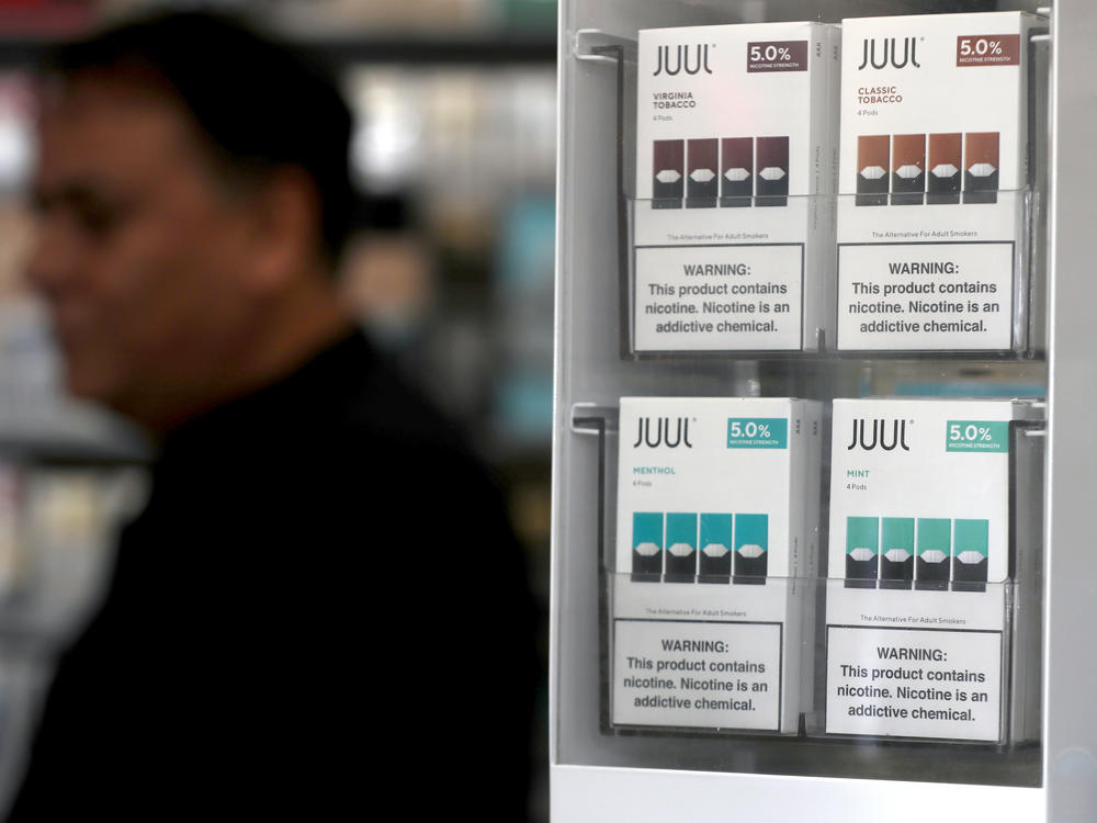 Packages of Juul mint-flavored electronic cigarettes are displayed at San Rafael Smoke Shop in 2019 in San Rafael, Calif.