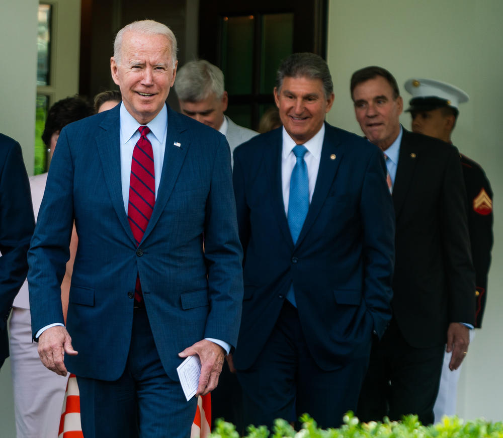 Passage of the nation's most expansive climate proposal ever could come down in part to a compromise between two prominent Catholic politicians: President Biden and Sen. Joe Manchin, D-W.Va.