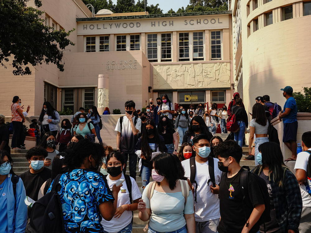 Students exit Hollywood High School after a day of school in Los Angeles.