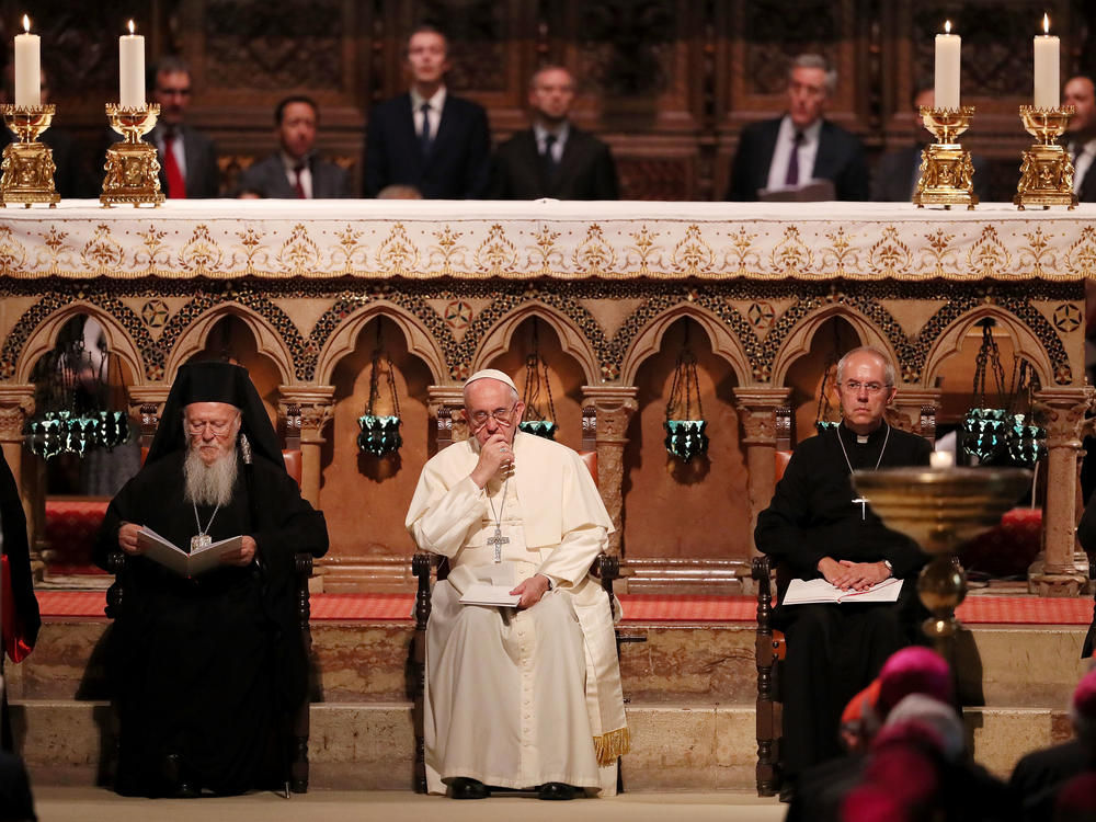 Pope Francis, Archbishop of Canterbury Justin Portal Welby and Archbishop of Constantinople and Ecumenical Patriarch Bartholomew, shown at a meeting of prayer in the Basilica of St. Francis in 2016, are asking for climate action.