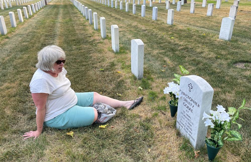 Dr. Pam Shultz, the mother of Army Lt. Chris Goeke, visits his gravesite at the Fort Snelling National Cemetery in Minneapolis, Minn.