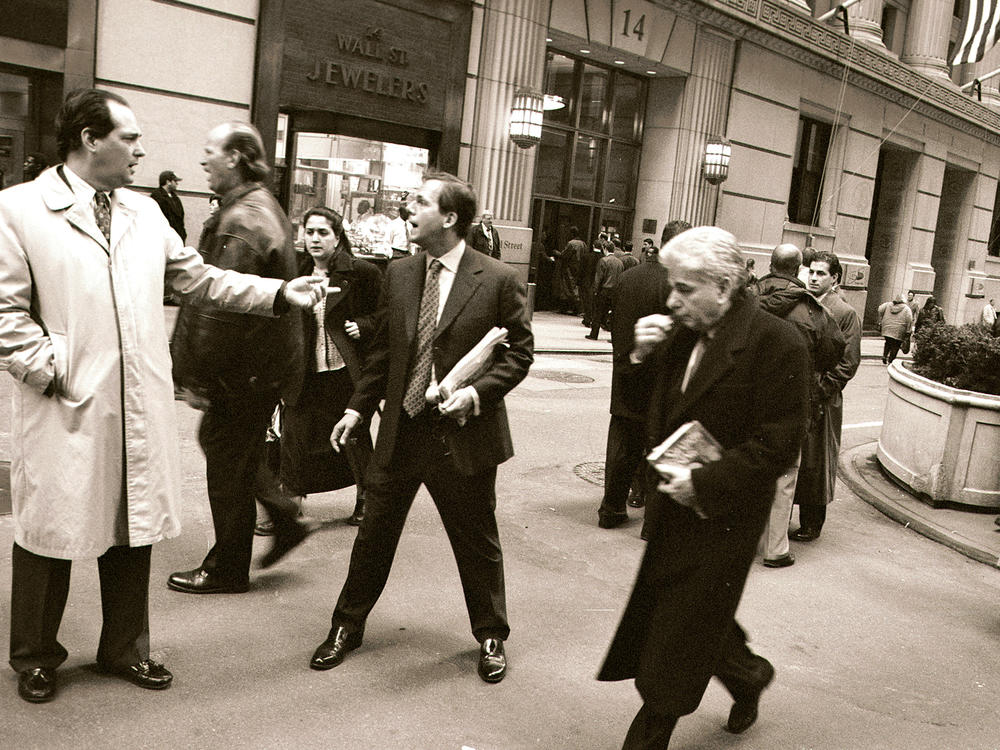 Two traders argue after leaving the New York Stock Exchange March 15, 2001 after the closing bell. Before 9/11, almost half of the jobs here were in finance, insurance, and real estate, according to Downtown Alliance. Today, it's roughly a third.