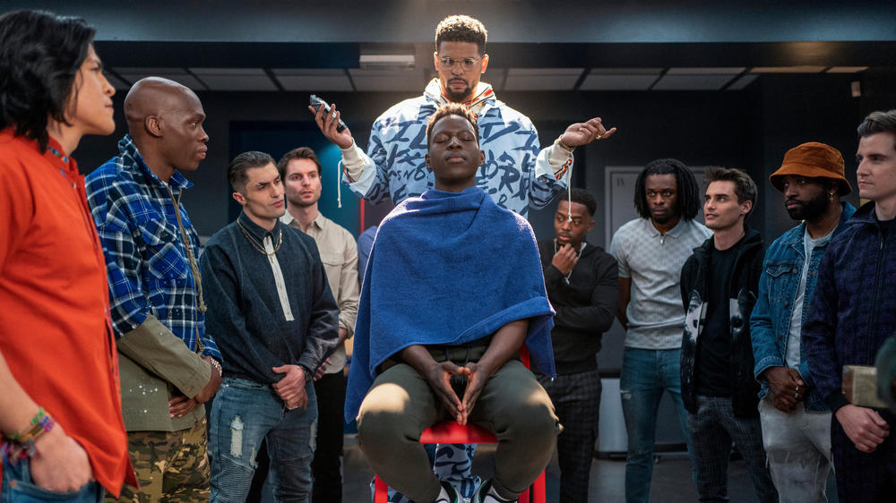 Isaac (Kola Bokinni) gives a haircut to an excited Sam (Toheeb Jimoh) as he prepares for his date.