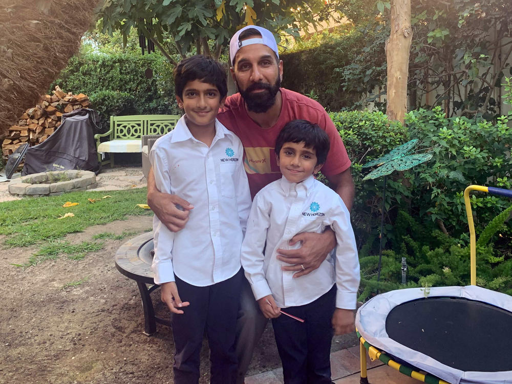 Ali Malik, 37, with his sons Muhammad Binyamin, 9, and Layth Noah, 5. Malik is part of a class action lawsuit against the FBI alleging religious discrimination and violations of surveillance laws.