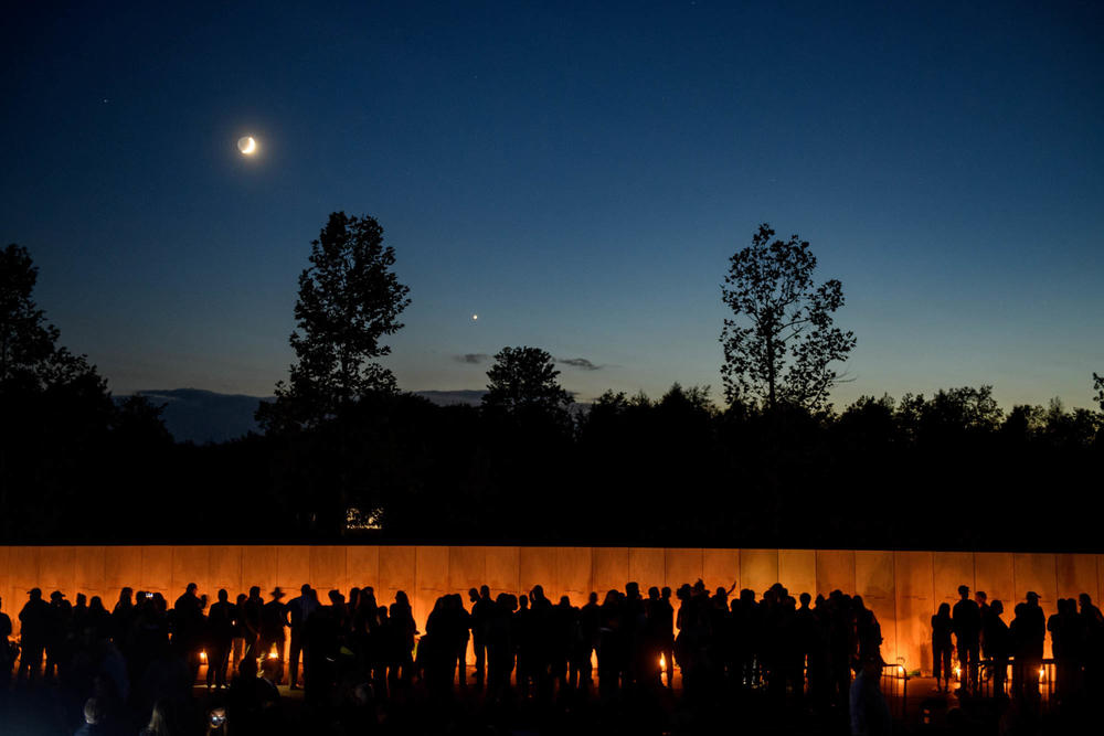 Visitors line the Wall of Names at the Flight 93 National Memorial on Friday in Shanksville, Pa. The Luminaria Ceremony commemorates the 40 victims of Flight 93.
