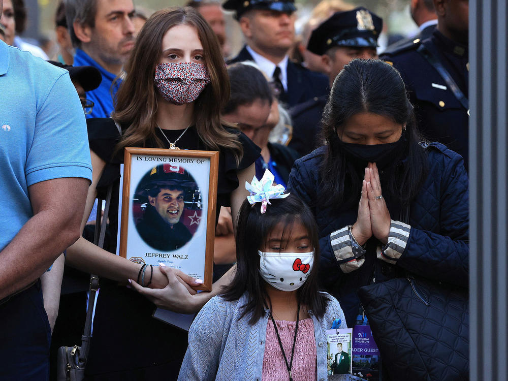 Family members and loved ones of victims of those who died on 9/11 attend the 20th anniversary commemoration ceremony on Saturday at the National September 11 Memorial & Museum in New York City.