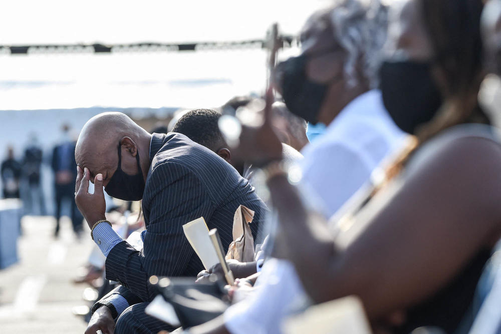 An attendee reacts during a 9/11 remembrance ceremony at the Pentagon in Arlington, Va., on Saturday.