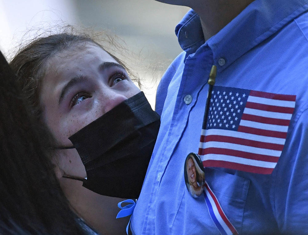A family member grieves at the National 9/11 Memorial and Museum ceremony commemorating the 20th anniversary of the 9/11 attacks on the World Trade Center, in New York City on Saturday.