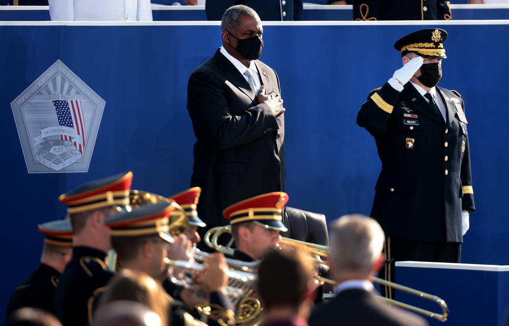 Defense Secretary Lloyd Austin (left) and Chairman of the Joint Chiefs of Staff Gen. Mark Milley stand for the national anthem during the Pentagon 9/11 observance ceremony.