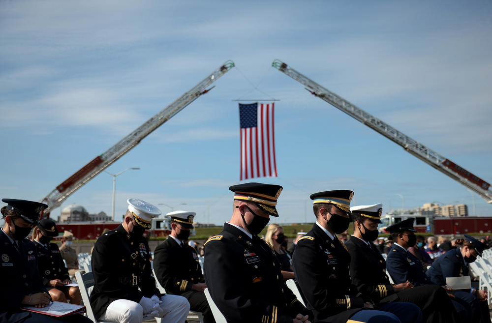 U.S. service members attend the 9/11 observance ceremony at the National 9/11 Pentagon Memorial in Arlington, Va.