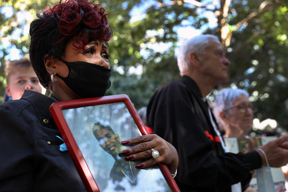 Family members and loved ones of victims attend Saturday's ceremony in New York City. Six moments of silence were held, marking when each of the World Trade Center towers was struck and fell, and the times corresponding to the attack on the Pentagon and the crash of Flight 93.