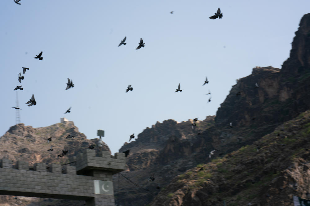 Birds fly above Torkham.