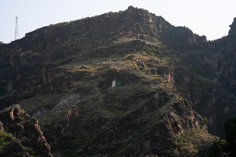 The border fencing between Pakistan and Afghanistan extends up the mountains near Torkham.