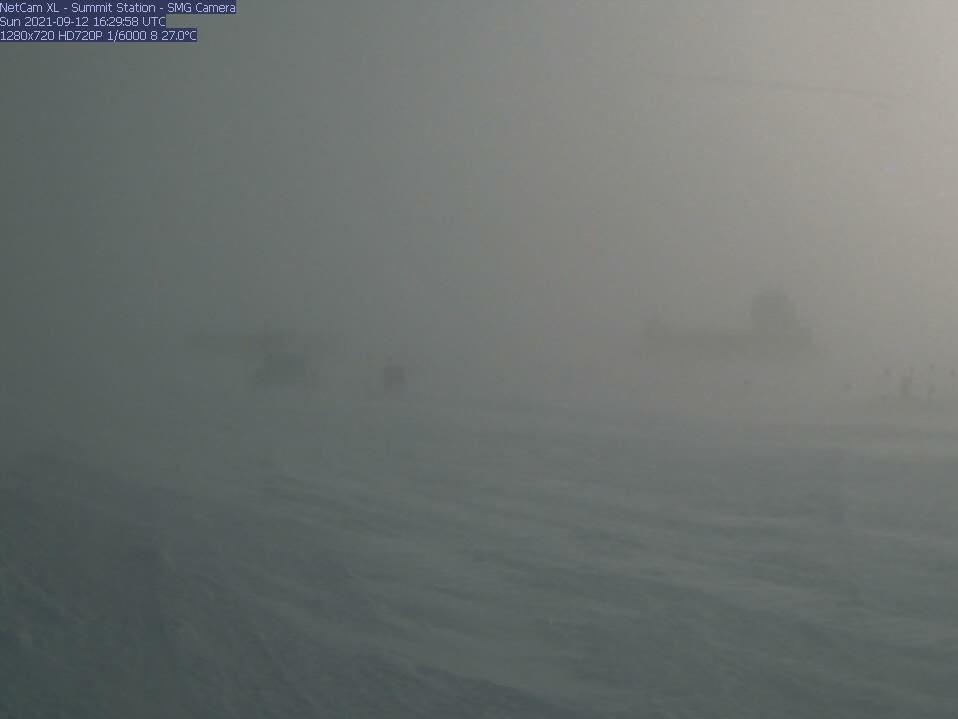 A webcam still showing blizzard conditions at Summit Station, a weather research station at Greenland's highest point. In August, the station recorded rain for the first time ever.