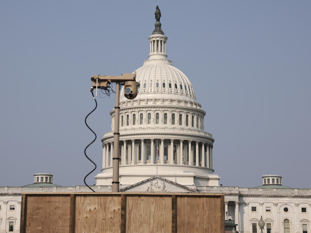 A recently installed surveillance camera is positioned near the U.S. Capitol on Monday.