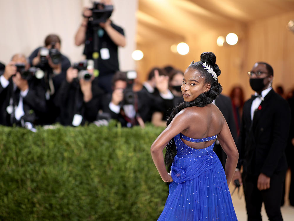 Co-chair Amanda Gorman dons a cobalt-blue Vera Wang gown and a book-shaped clutch that says 